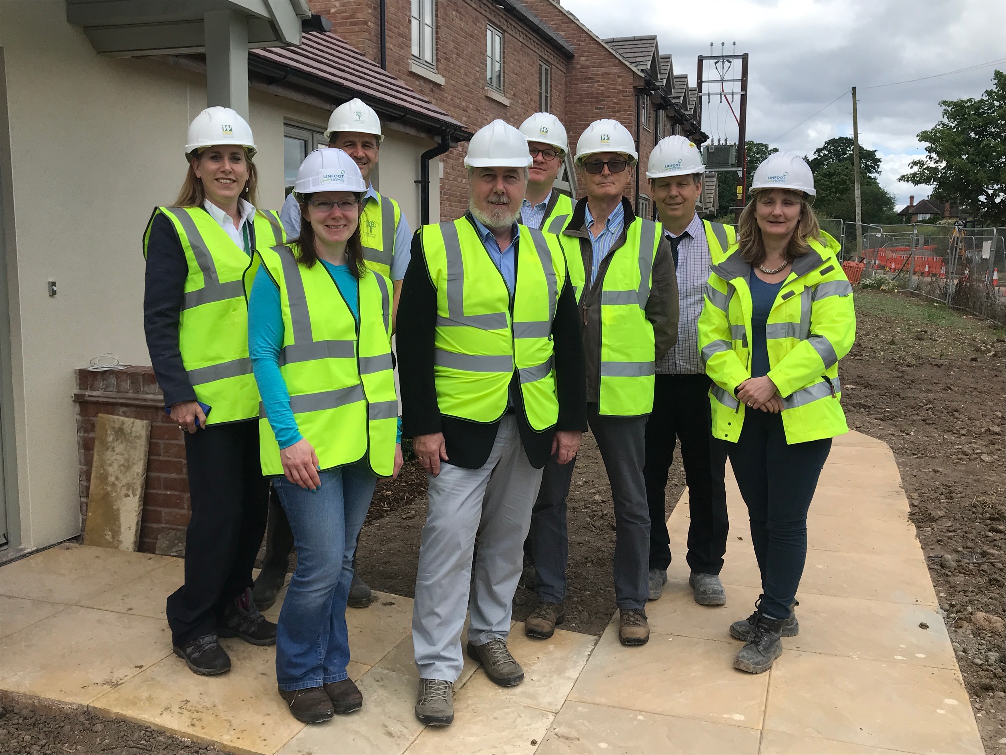 Left-Right: Warwickshire Rural Community Council's rural housing enabler Sarah Brooke-Taylor, Great Alne Parish Council's Hazel Mainwaring, WRHA development officer Neil Gilliver, WRHA chairman Derrick Dyas, WRCC chief executive Kim Slater, Great Alne PC chair Lynn Bowring and builders Linfoot Country Homes site manager Steve Woodington and managing director Claire Linfoot McLean.